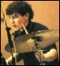 < Tony McCarroll >